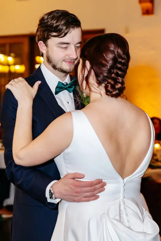 Couple dancing close at the reception